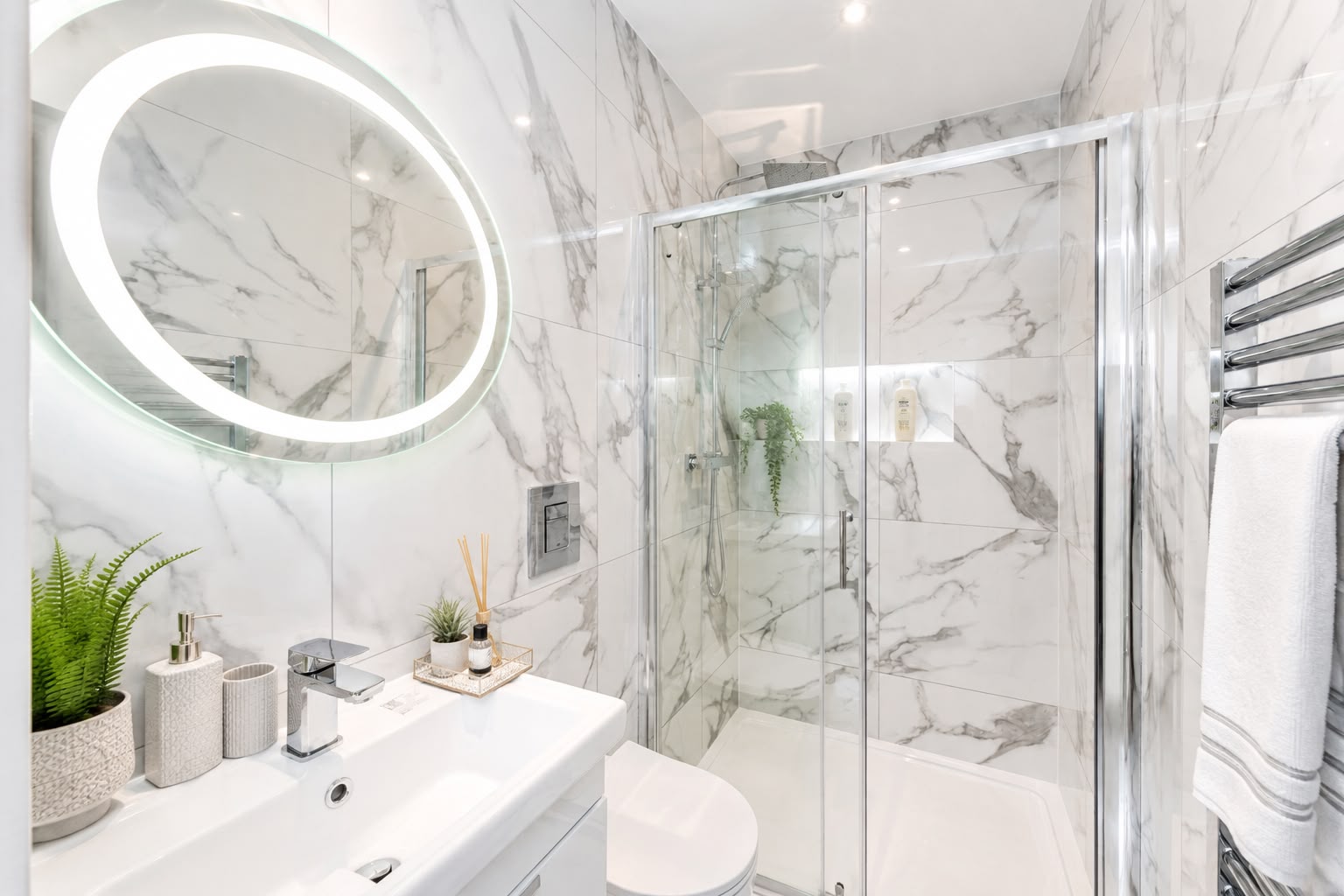 Marble-tiled bathroom with walk-in shower